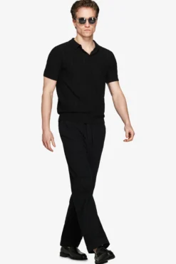 Polo in maglia traforata nera